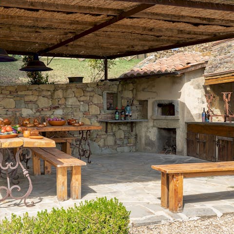 Cook up a rustic feast in the outdoor kitchen