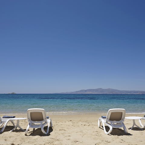 Wander out and onto Plaka Beach to enjoy the sun and sand