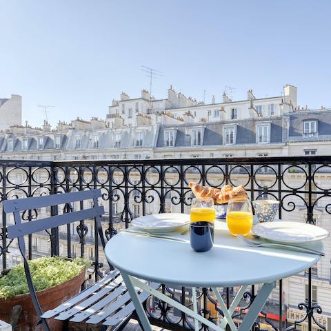 Tuck into French pastries and sip coffee on the charming balcony