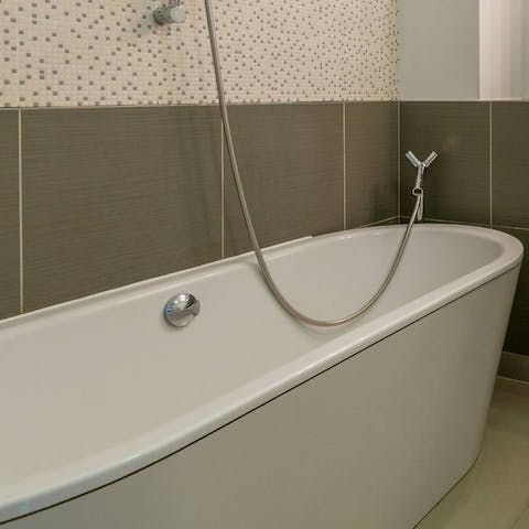 Enjoy a long and lovely soak in the freestanding bath after busy days in the city