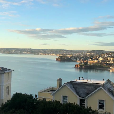 Look out to idyllic views across the bay from the living room