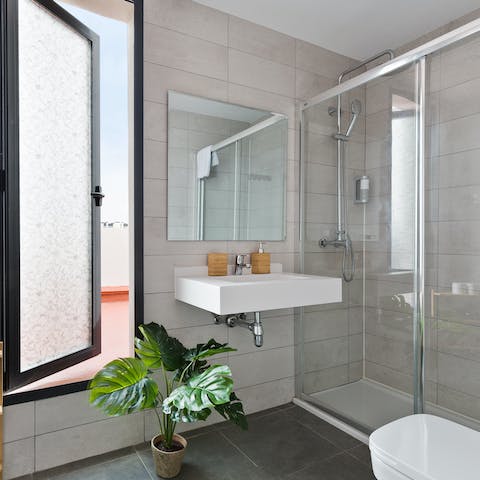 Start your mornings with a relaxing soak under the bathroom's rainfall shower