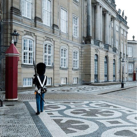 Take the five minute stroll to the Amalienborg Palace