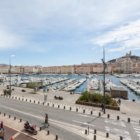 Enjoy portside views from your balcony, overlooking the Notre-Dame de la Garde