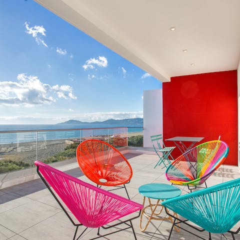 Soak up the sunshine from colourful balcony seating