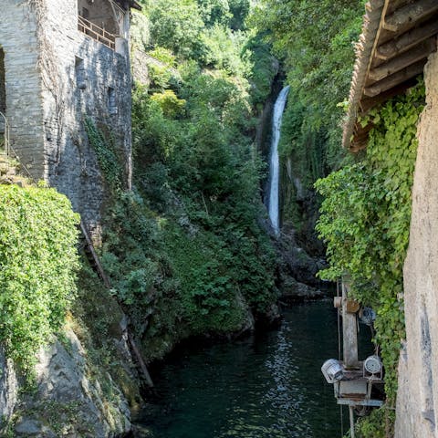Marvel at the Orrido, a 200-metre high waterfall, less than one minute stroll away