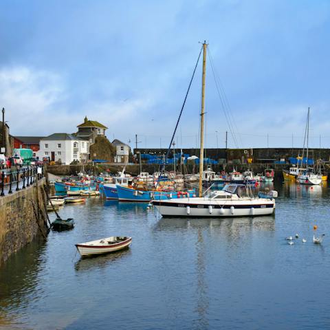 Wander the quaint streets and explore the restaurants and shops at Mevagissey harbour
