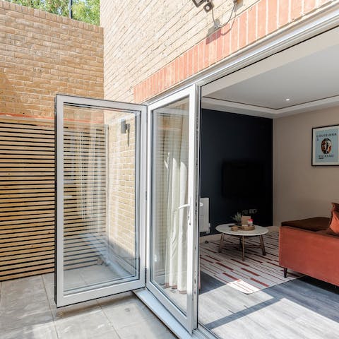 Slide open the bi-folding doors and let the fresh air into the living area