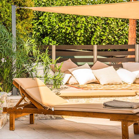 Relax and unwind on the sun bed and loungers