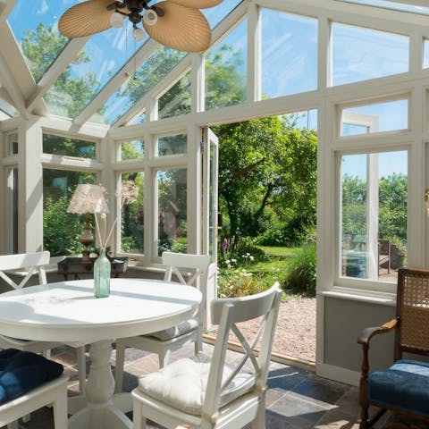 Soak up the sun in the conservatory overlooking the garden and nearby nature reserve