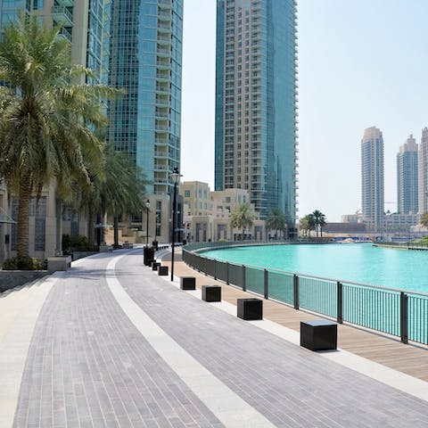 Walk along the palm-lined riverside of Dubai Marina, just outside your front door