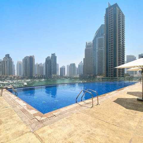 Head to the building's rooftop swimming pool for a cooling dip