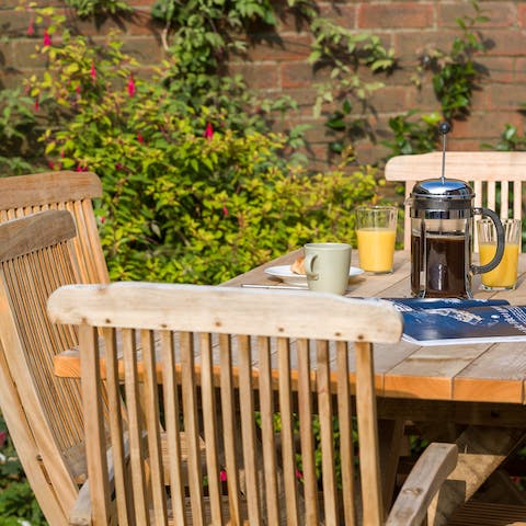 Greet the day with a lazy breakfast out on the home's patio