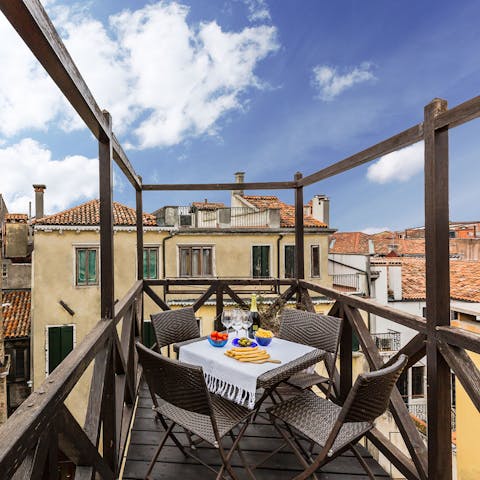 Admire the glorious vistas of Venice while you sip on wine on the terrace
