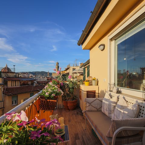 Watch the sun set across the city among the plants on your second balcony