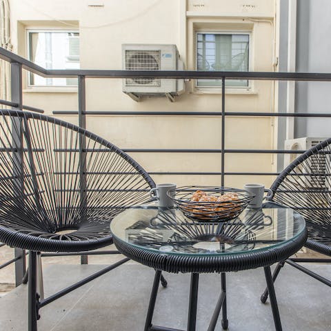 Start your day with a cup of freshly brewed coffee out on the balcony 