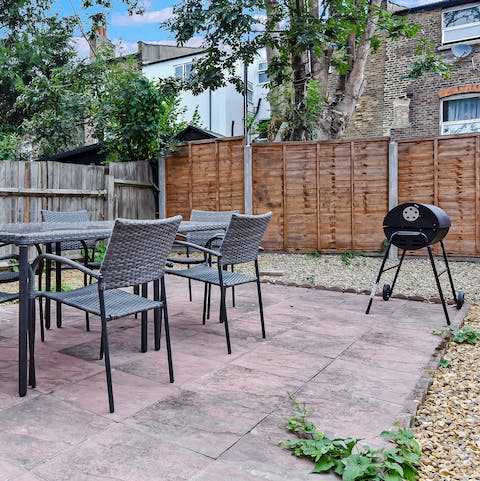 Enjoy alfresco meals in your private garden, with comfy seating and a barbecue 