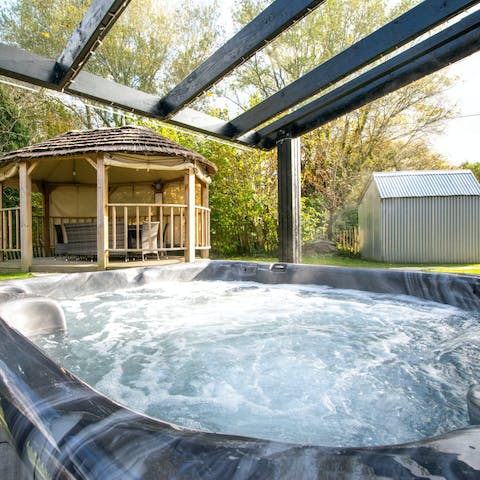 Pour yourself a glass of bubbly and let your cares soak away in the hot tub