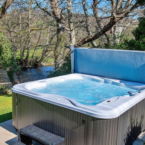 Soak in the riverside hot tub after a day spent hiking, cycling or climbing