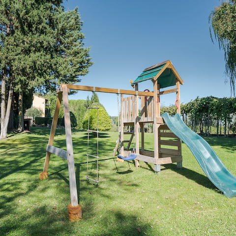 Let the kids play on the slide and swings