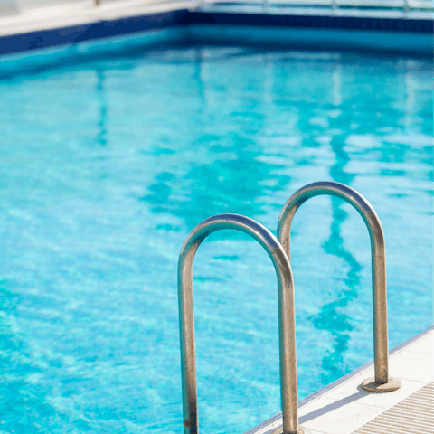 Take a refreshing dip in the communal swimming pool