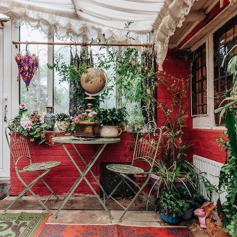 Have a cup of tea in the foliage-filled conservatory