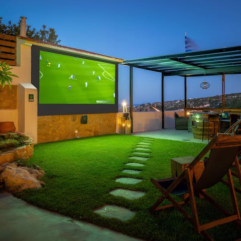 Put on your favourite family film to watch on the outdoor screen