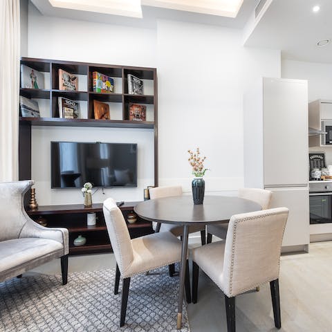 Whip up a meal in the sleek kitchen and share your fare around the dining table