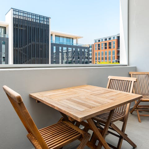 Enjoy your morning coffee from your bright balcony, complete with cute table and chairs