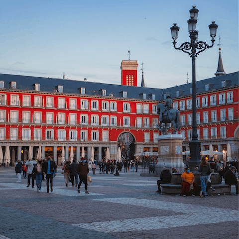 Grab a glass of wine and soak up the ambience on Plaza Mayor