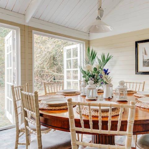 Throw open the French doors in the elegant dining space