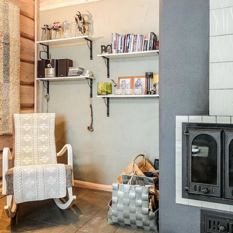 Cosy up in the rocking chair to read a book by the fireplace