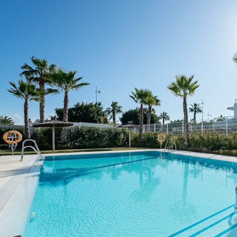 Enjoy a refreshing dip in the communal pool 