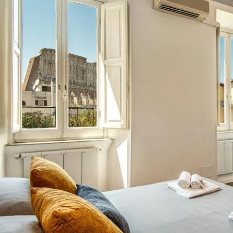 Wake up to views of the Colosseum from your comfortable bed