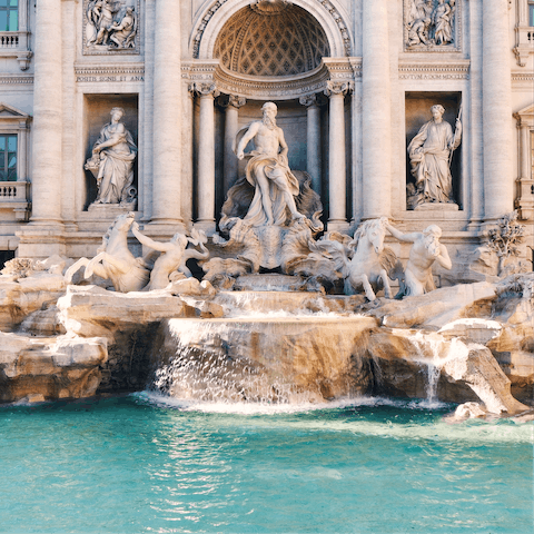 Hop on the bus and head over to the famous Trevi Fountain