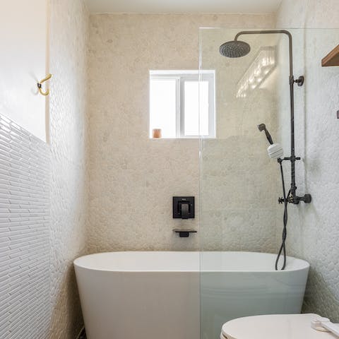 Soak your worries away in the large free-standing bath tub