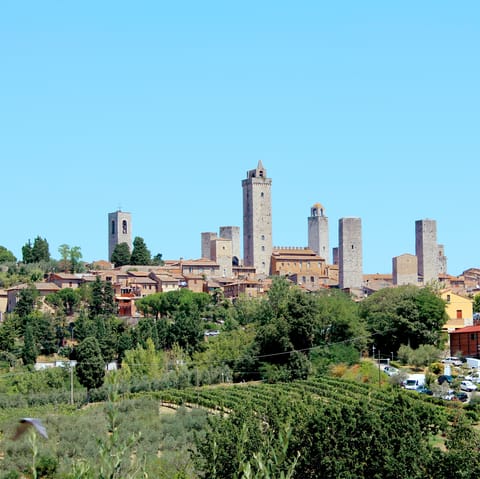 Marvel at the mediaeval architecture in nearby San Gimignano