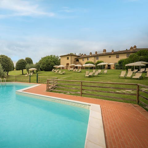 Feel the Tuscan sun warm your skin from in or beside the communal pool