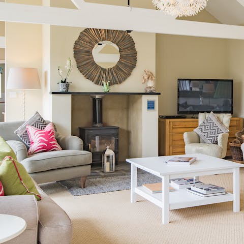 Spend chilly evenings in the cosy living room, snuggled up around the wood-burning stove 