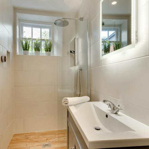 Start mornings off with a relaxing soak under the rainfall shower