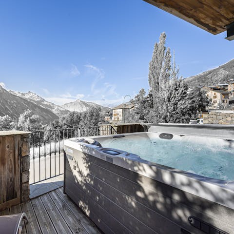 Look out at the Alps while unwinding in the jacuzzi