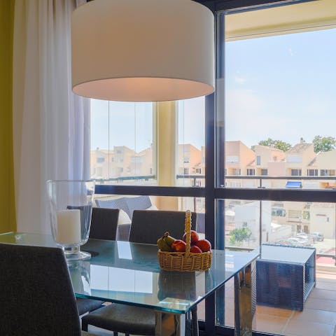 Dine with a view over the rooftops out through the glass door