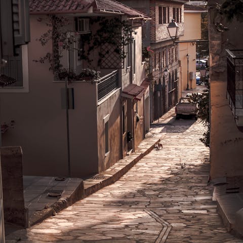 Wander the winding streets of Kalamata's old town,  a short drive away