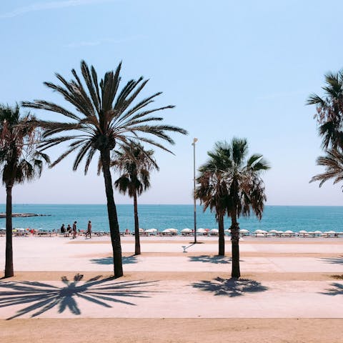 Spend warm afternoons relaxing on Barceloneta Beach, reached in thirty minutes by bus