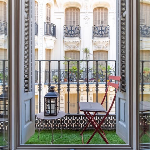 Enjoy a tinto de verano (or two) on the balcony