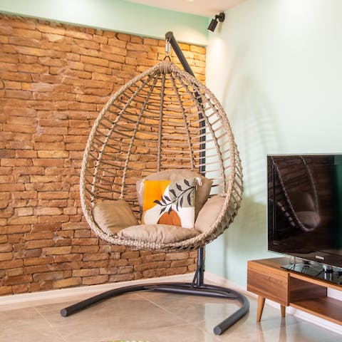 Relax with your morning coffee in the hanging egg chair