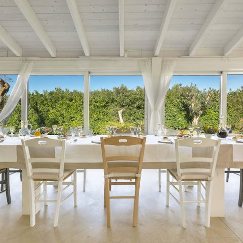 Enjoy a sun-filled breakfast at the dining table inside, thanks to a wall of windows