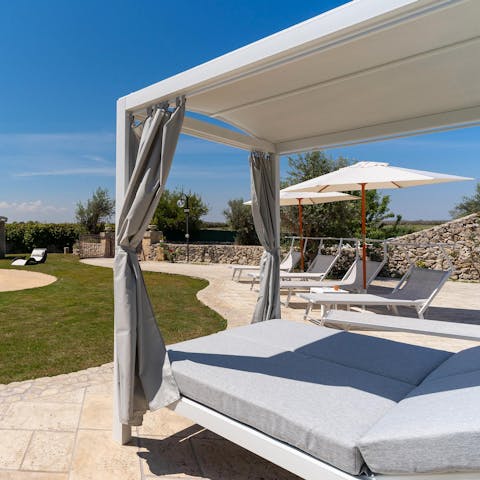 Stretch out on the double day bed and shade from the southern sunshine