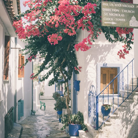 Walk the streets of Skiathos, a seven minute drive away