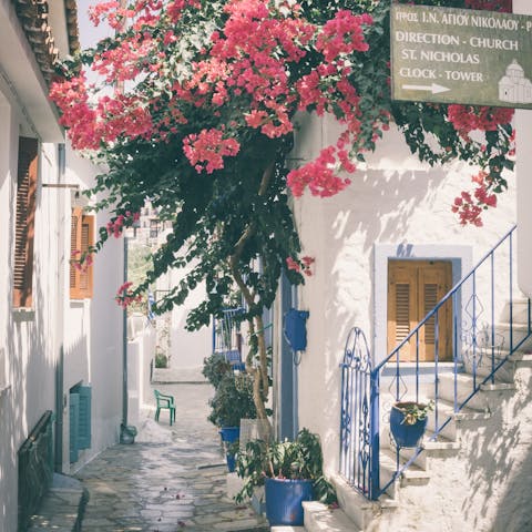 Walk the streets of Skiathos, a seven minute drive away